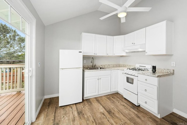 kitchen featuring sink, white cabinetry, vaulted ceiling, light hardwood / wood-style flooring, and white appliances