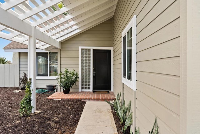 doorway to property with a pergola