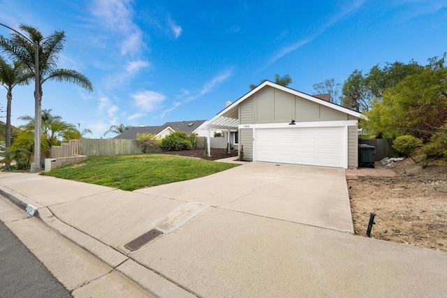 view of front of property with a garage and a front yard