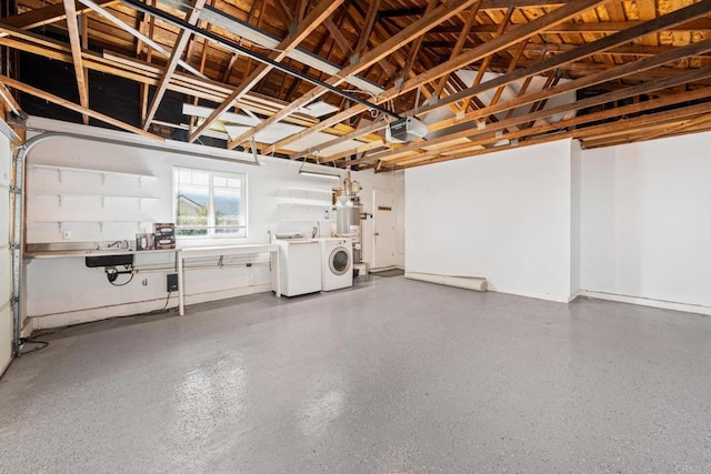 garage featuring a garage door opener and separate washer and dryer