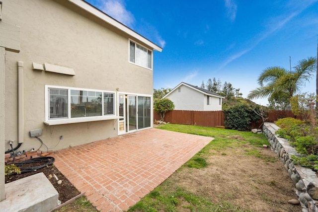 back of house featuring a patio area