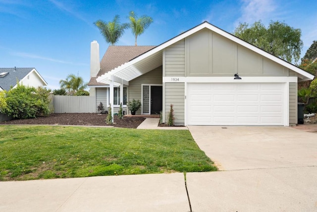 view of front of house featuring a garage and a front yard