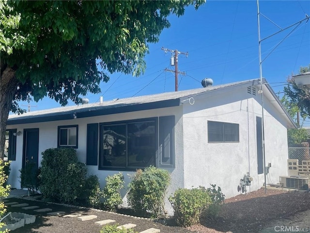 view of front of home featuring cooling unit