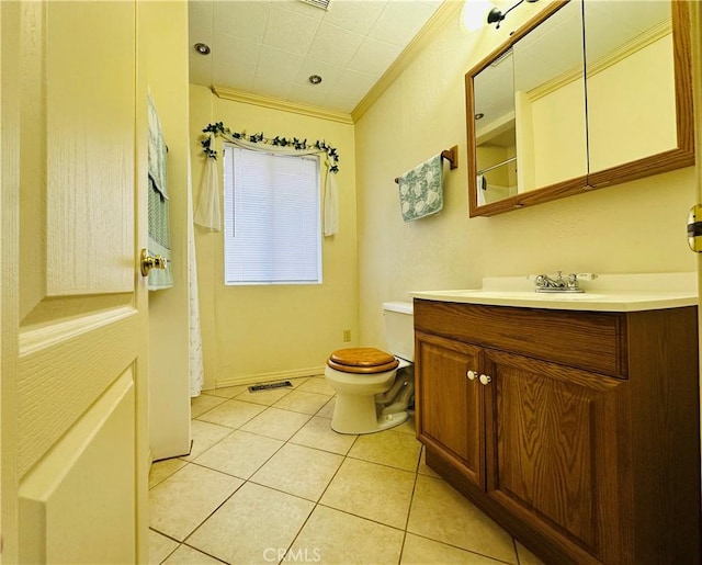 bathroom featuring crown molding, tile patterned floors, toilet, and vanity