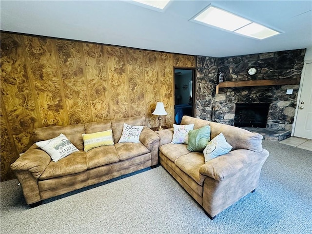 living room with a stone fireplace