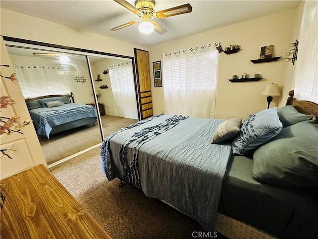 carpeted bedroom with a closet and ceiling fan