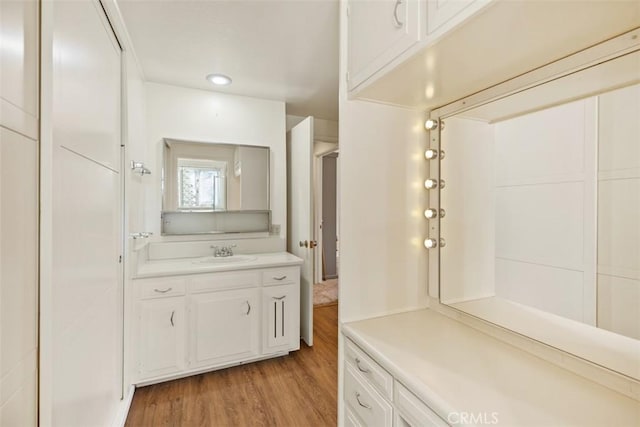 bathroom featuring vanity and hardwood / wood-style flooring