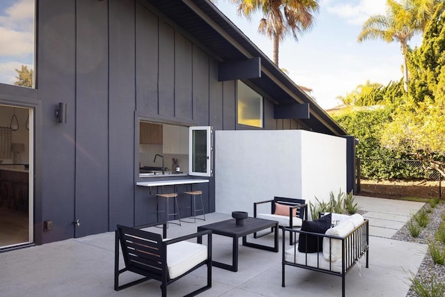 view of patio / terrace with an outdoor hangout area and sink