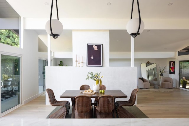 dining space with light wood-type flooring