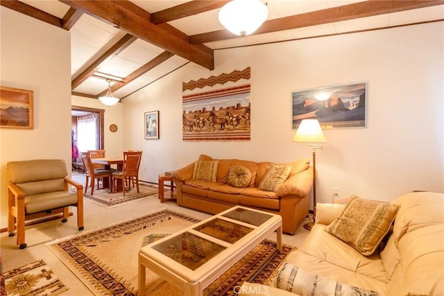 living room with carpet flooring and vaulted ceiling with beams