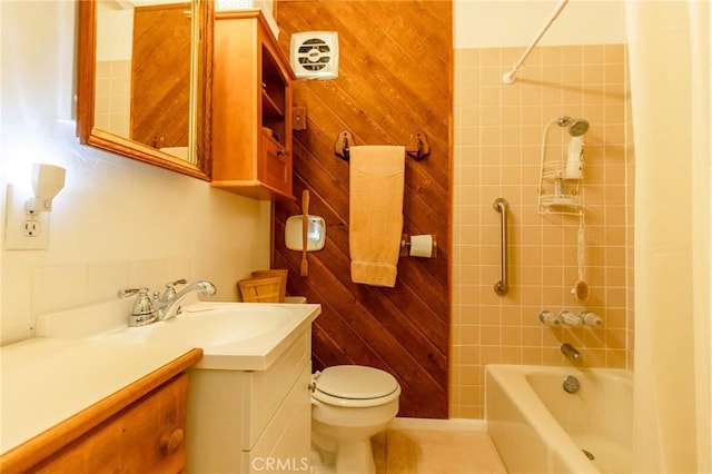 full bathroom with vanity, toilet, and tiled shower / bath combo