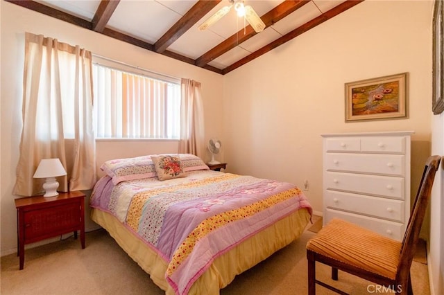 carpeted bedroom featuring vaulted ceiling with beams and ceiling fan