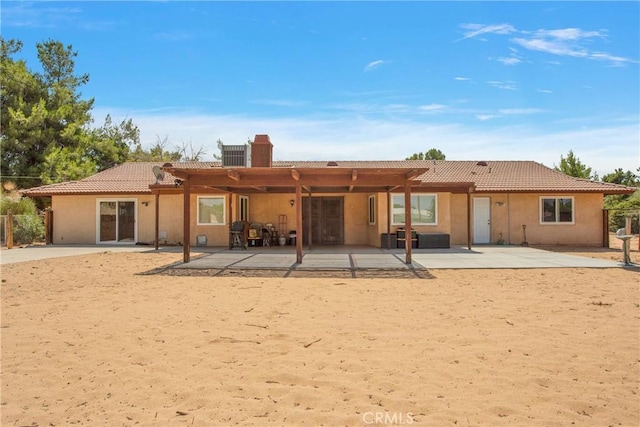 rear view of house with a patio area