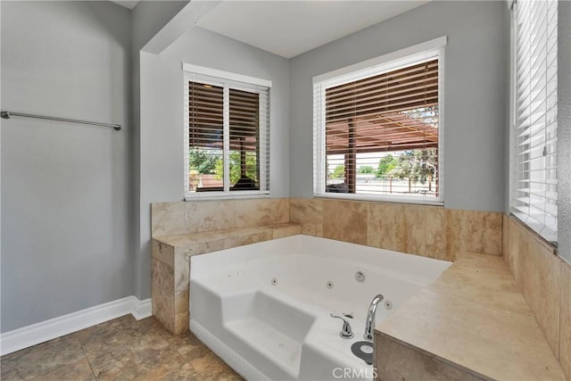 bathroom with a tub to relax in