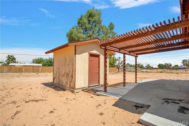 view of outbuilding featuring a pergola