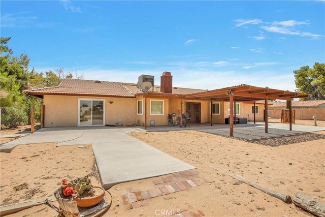 rear view of house featuring a patio