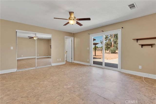 interior space with ceiling fan