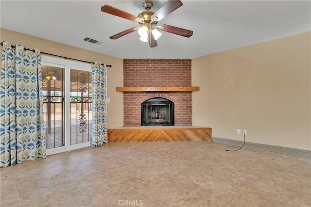 unfurnished living room featuring ceiling fan and a fireplace