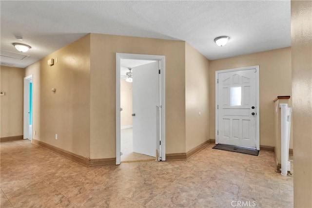 entryway with a textured ceiling