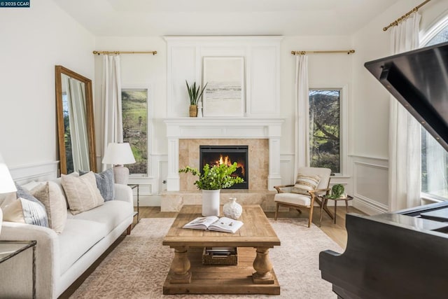 sitting room featuring wood-type flooring and a fireplace