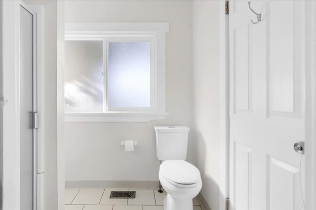 bathroom with tile patterned floors and toilet