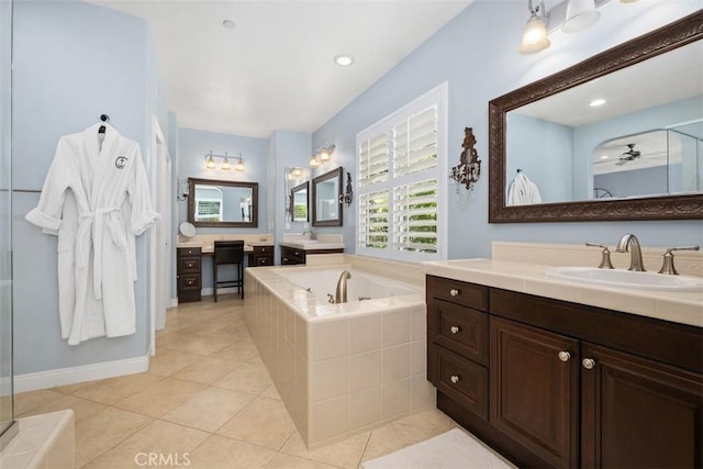 20 Bentley Rd, Coto De Caza, CA 92679 - bathroom with a bath, two vanities, tile patterned floors, and a shower with door
