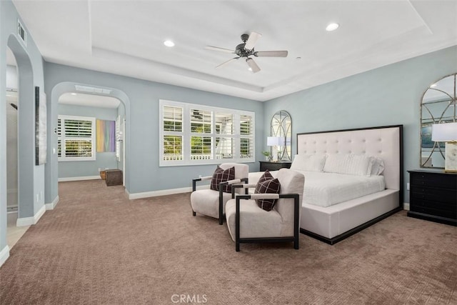 20 Bentley Rd, Coto De Caza, CA 92679 - bedroom with a tray ceiling, carpet, arched walkways, recessed lighting, and baseboards