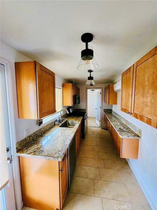 kitchen featuring light stone counters, sink, stainless steel appliances, and a wall mounted AC