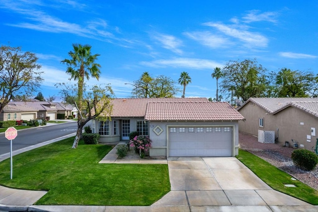 single story home featuring a garage and a front yard