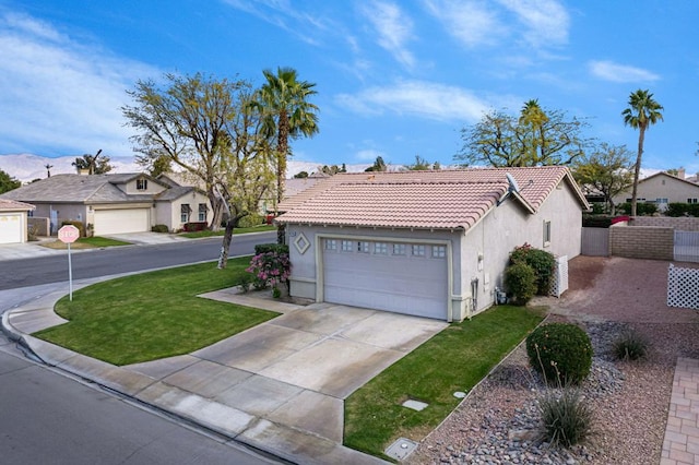 view of property exterior featuring a garage and a lawn