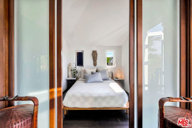 bedroom featuring vaulted ceiling