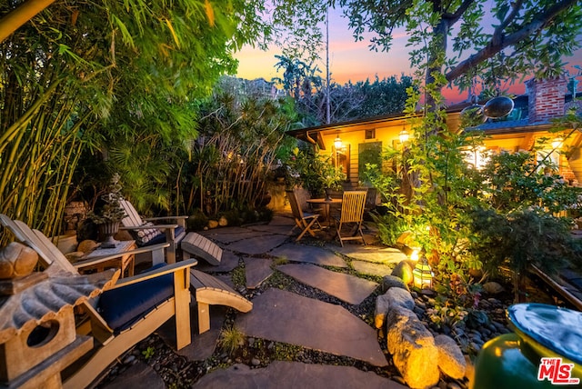 view of patio terrace at dusk