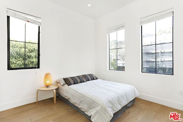 bedroom with light wood-type flooring