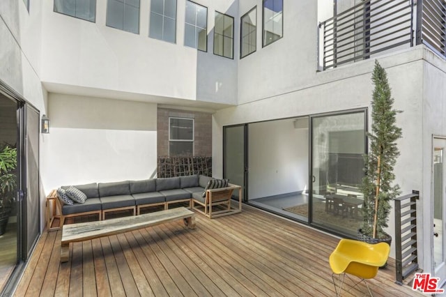 wooden deck featuring an outdoor hangout area