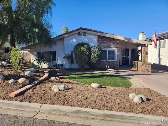 single story home featuring stucco siding