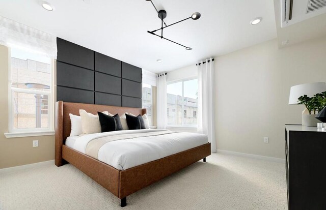 bedroom with light colored carpet