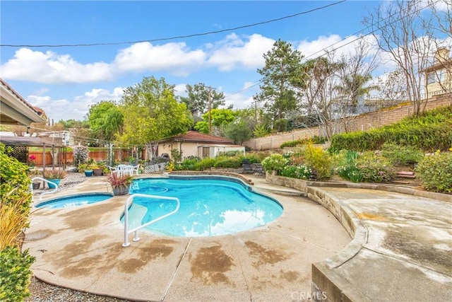 view of pool with a fenced in pool, a patio, an in ground hot tub, and a fenced backyard