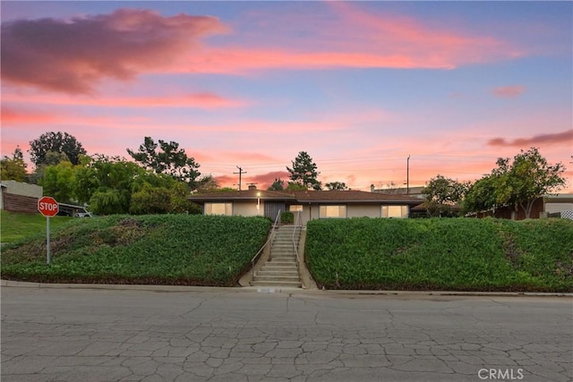 view of front of home with stairs