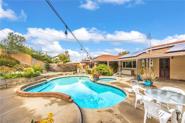 view of swimming pool with outdoor dining space, a patio, a fenced in pool, an in ground hot tub, and a fenced backyard