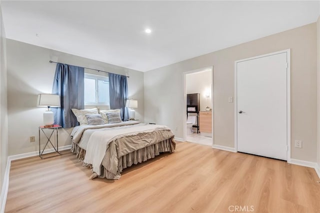 bedroom with light wood-type flooring