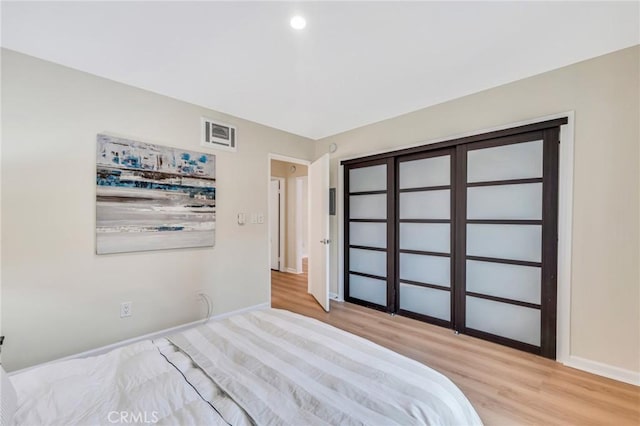 unfurnished bedroom featuring light wood-type flooring