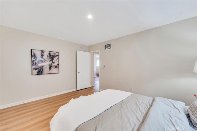 bedroom featuring wood-type flooring