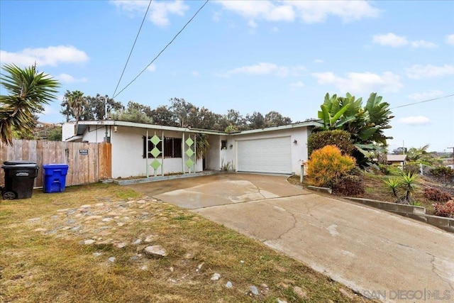 single story home with a garage