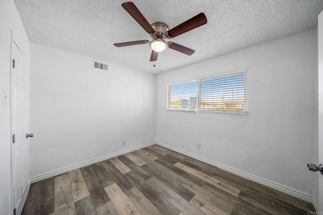 spare room with ceiling fan, hardwood / wood-style floors, and a textured ceiling