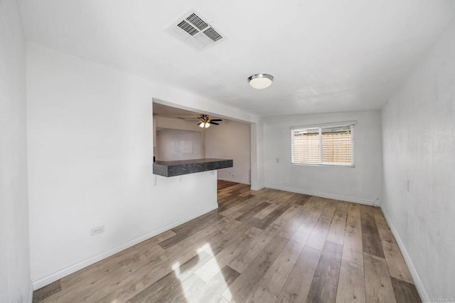 interior space with light hardwood / wood-style flooring and ceiling fan