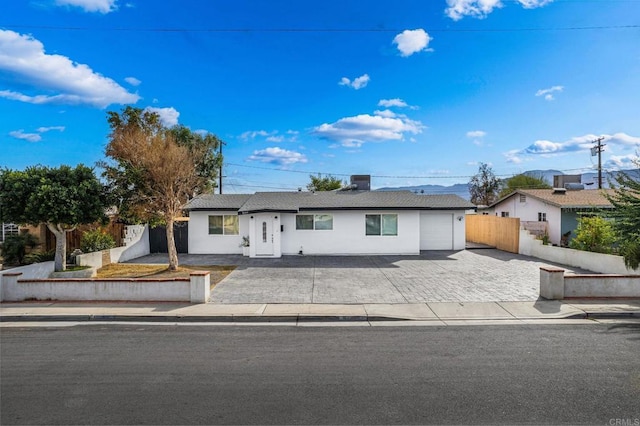 ranch-style house featuring a garage