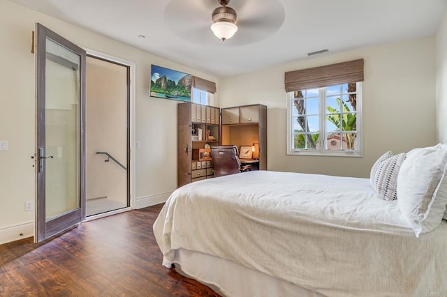 bedroom with ceiling fan and dark hardwood / wood-style floors