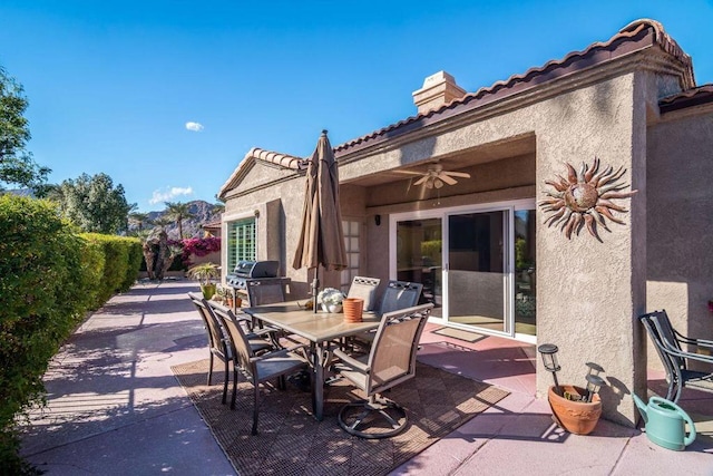 view of patio / terrace featuring grilling area and ceiling fan