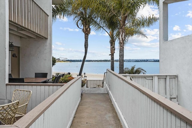 balcony featuring a water view