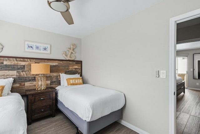 bedroom with ceiling fan and dark hardwood / wood-style flooring